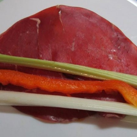 1. Stage. Bresaola rolls with vegetables: Put a slice of each vegetable on the edge of the breazole.