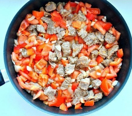 1. Stage. Veal Laghman: Then add vegetables to the meat and cook stirring for about 10 minutes.