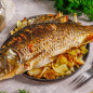 Запеченный карп в духовке с капустой