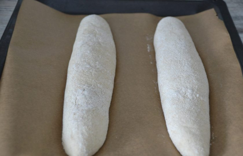 1. Этап. Багет ржаной: Заготовки багета после расстойки. Аккуратно перенесите их на противень, застеленный пекарской бумагой все так же, 