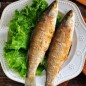 Fried mullet in a pan