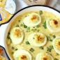 Яйца в сырном соусе