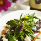 Beet salad, salad mix and goat cheese with plum dressing