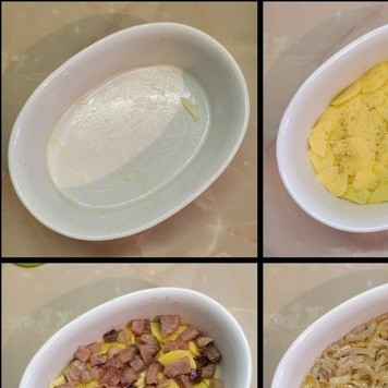 1. Этап. Португальская запеканка из рыбы: Форму для запекания смазать сливочным маслом, на дно выложить половину картофеля, посолить, поперчить, сверху выложить половину рыбы, на нее уложить обжаренный лук, затем оставшуюся рыбу и сверху укрыть оставшимся картофелем, слегка прижав все руками. Содержимое формы залить сливками, сверху разложить кусочки оставшегося сливочного масла.