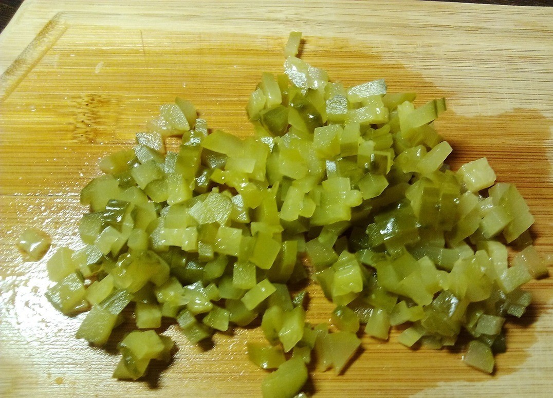 1. Stage. Lavash rolls: Cut the cucumber into cubes.