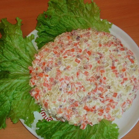 1. Stage. Goldfish Salad: Put the finished salad on a dish with lettuce in the shape of a fish.