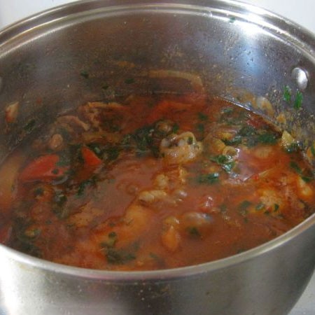 1. Stage. Chakhokhbili: Finely chop the greens and add half to the pan, simmer another 20-30 minutes until the meat becomes very soft.