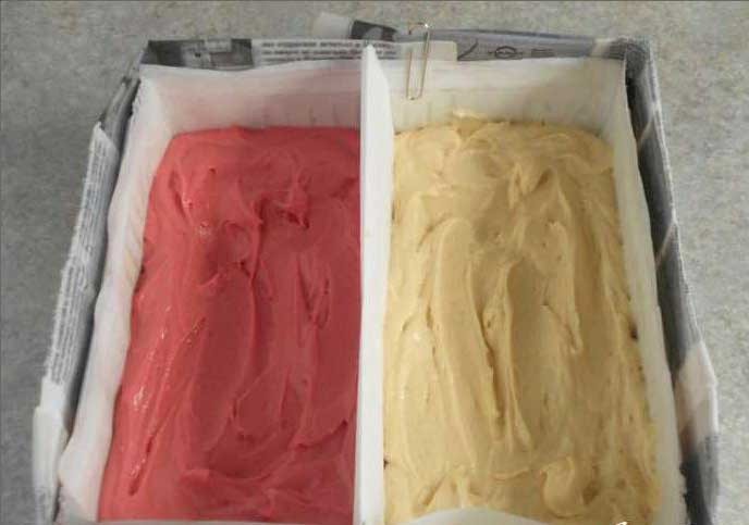 1. Stage. Chess Cake: Divide the dough into two equal parts and add dyes to them. On a baking sheet, put two sheets of parchment paper to separate the two types of dough. Do not roll out the dough and make it in the form of sticks, so that you can then be cut into 2 parts. Bake for 45 minutes.