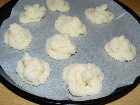 1. Stage. Coconut Cookies: In a medium bowl, combine butter, brown sugar, and white sugar until smooth. Beat the egg and vanilla until foam. Gradually mix all the ingredients and add coconut. Put cookies on a baking sheet with covered baking paper.