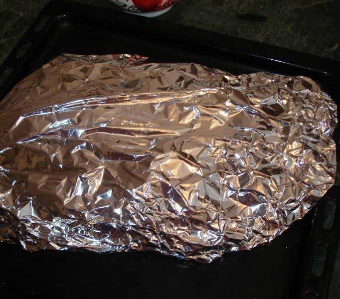 1. Stage. Potatoes with beans: On a large sheet of foil, put green beans, red potatoes, onions and sausage. Season with salt and pepper, top with vegetable and butter. Seal the foil tightly leaving a small hole. Pour water into the hole, and seal.