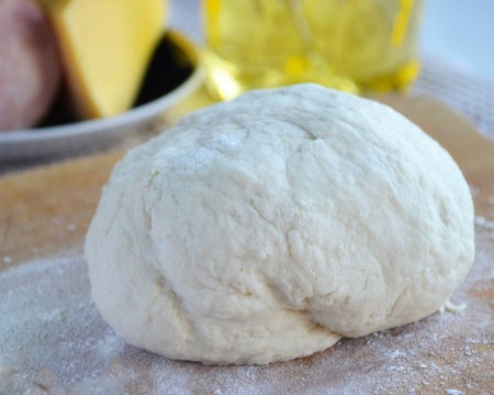 1. Stage. Cheese Puff Pastry Envelopes: Add salt and flour to kefir, knead the dough and put it in a warm place for half an hour.