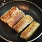 Блинчики с куриным мясом Тесто Шаг 1: Взбиваем яйца. (Не обращайте на количество яйц на фото, я готовила двойную порцию). Можно взбивать и венчиком, и миксером. Всё очень легко и просто. Шаг 2: Наливаем воду в яйца. Простую, из под крана. Затем по-одному стакану добавляем муку. По-одному, чтоб не образовались комочки. Хотя комочки не проблема, их спокойно можно убрать маленьким ситом. Взбиваем. Шаг 3: Наливаем масло и засыпаем соль. Снова взбиваем. Вот какой в итоге консистенции получается тесто. Шаг 4: Разогреваем сковороду, в моём случае их было три, смазиваем маслом и заливаем тесто. Извините за беспорядок, я очень спешила, мой маленький сынуля не давал покоя. Жарим блины только с одной стороны. Вот столько блинов у меня вышло из двойной порции. 110 штук. Из данной в рецепте где-то 50-60 штук, зависит от сковородки. Фарш Шаг 1: Ставим тушиться куриное мясо, наливаем немного воды, когда потушится, налейте масло, но тоже немного, ведь лук жарится на масле. Поджариваем. Я хорошенько поджариваю фарш, чтоб стал золотистым. Шаг 2: Жарим лук. Заодно варим рис. Я сварила предварительно. ( Но чаще всего я тушу мясо, варю рис и жарю лук одновременно). Даже если рис переварится, не страшно, на вкус фарша это никак не повлияет. Шаг 3: Как только мясо будет готово. Добавляем лук, рис, зелень, перец и соль. Вот такой фарш получился. Вкус у фарша такой, что не сразу поймешь из какого он мяса, это из-за того что мы его хорошенько поджарили. Пришло время закручивать блины. Фарш кладём на поджаренную сторону. Вот какими они получаются. Можем жарить, а можем отправить в холодильник или в морозильник. В морозильнике их можно хранить долго, как полуфабрикат.