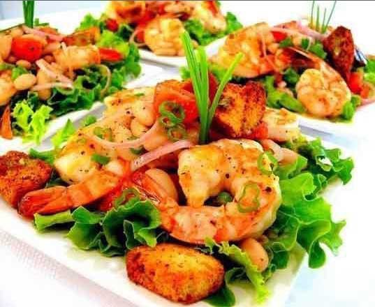 1. Stage. Salad Elegant: Tear lettuce leaves and place on separate plates or a dish and pour part of the remaining dressing. Put the salad on top and cover with a few shrimps. Pour the dressings over the shrimp. Add some crackers and garnish with green onions.