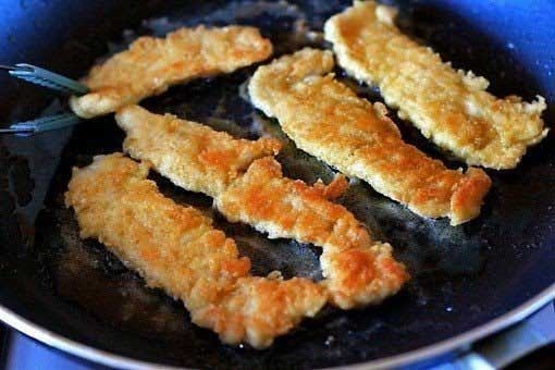 1. Stage. Crispy chicken sticks: Prepare the pan. Pour in oil and begin to heat it over medium heat. Fry each side for 3 minutes and remove from heat.