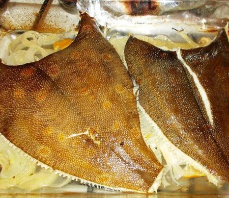 1. Stage. Baked Flounder: Fish is ready, serve with onions.