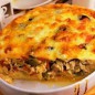 Пирог с баклажанами Мясо отварите в подсоленной воде до готовности, затем нарежьте кубиками. Муку смешайте с солью и разрыхлителем. Яйца взбейте, добавьте кефир и растительное масло, перемешайте, затем добавьте муку и замесите тесто. Заверните в пищевую пленку и положите в холодильник на пол часа. Пирог с баклажанами и курицей под сырной заливкой получается вкусным, сочным и сытным. Он прекрасно подойдет как полноценный обед или ужин для всей семьи. Готовить такой пирог довольно просто, так же в начинку можно добавить шампиньоны или другие грибы. Для заливки можно использовать сыр любого сорта. Приятного аппетита!!! Залейте пирог заливкой, выпекайте при 180 градусах около 50 минут. На тесто выложите овощи и курицу, приготовьте заливку. Взбейте яйца, добавьте тертый сыр и йогурт. Форму для выпекания смажьте маслом. Тесто раскатайте и выложите в форму сделав бортики. Проколите тесто вилкой в нескольких местах. Баклажаны нарезать кубиками, посолить и оставить на 10 минут. Лук нарежьте полукольцами, а перец соломкой. Обжарьте на растительном масле до румяности. В конце добавьте баклажаны и тушите до полуготовности. Так же можете добавить зелень.