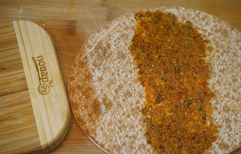 1. Этап. Бурум с курицей: 9. Лаваш разверните, смажьте его аджикой.