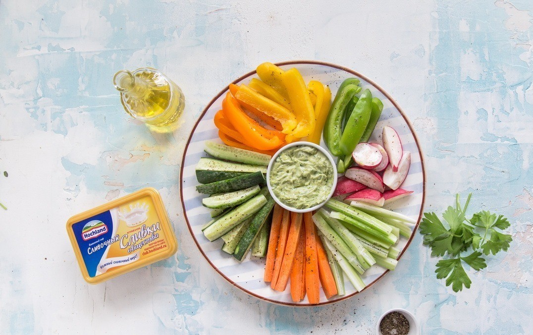 1. Stage. Cheese dip with fresh vegetables: Place a bowl of dip in the center of the dish. Arrange the vegetables in multicolored sectors around it. Serve immediately.