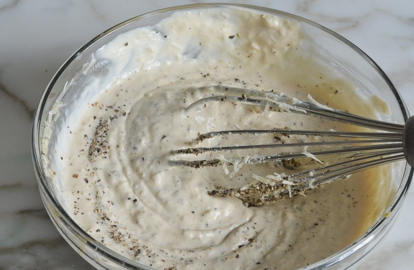 1. Этап. Соус для салата Цезарь простой: 2. Выложите в миску майонез, измельченный на мелкой терке сыр «Пармезан», соль, перец, взбейте все хорошенько.